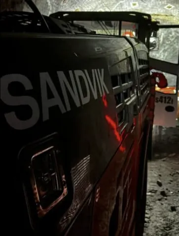 The side of a Sandvik machine underground.